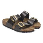 Sandalias Birkenstock Sydney Luxe Buckle Graceful Licorice, par completo en tres cuartos