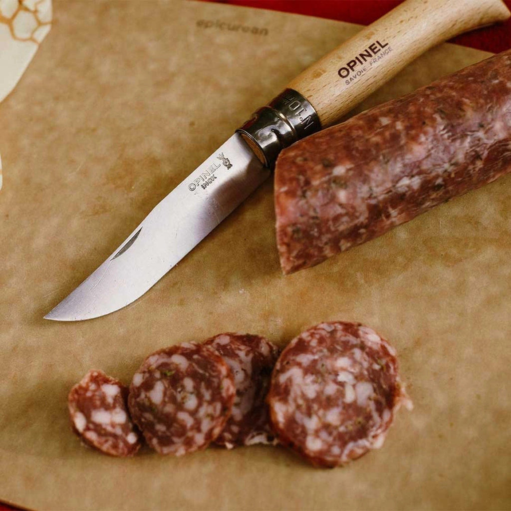 Cuchillo Opinel N°10 Stainless Steel - vista 4, cortando cecina, en uso, imagen de estilo de vida
